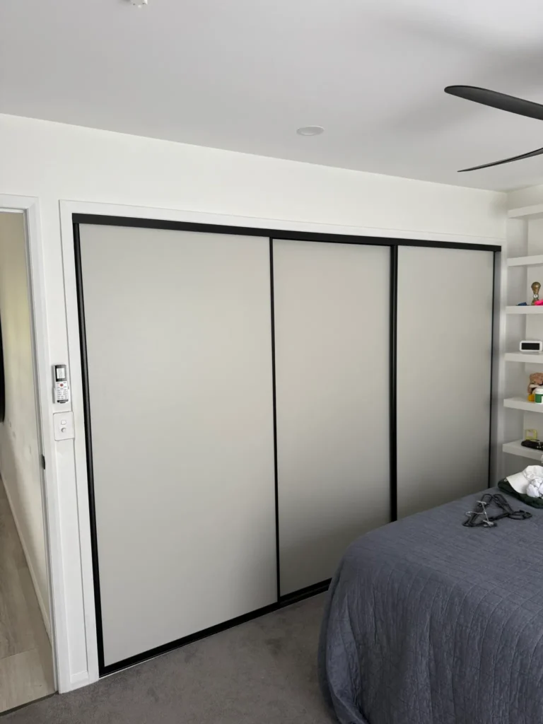 White board sliding wardrobe doors with black aluminium frame